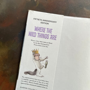 Where The Wild Things Are written and illustrated by Maurice Sendak-50th anniversary edition-2013-caldecott award-winning picture book-view of the inside flap of the dust jacket stating fiftieth Anniversary Edition