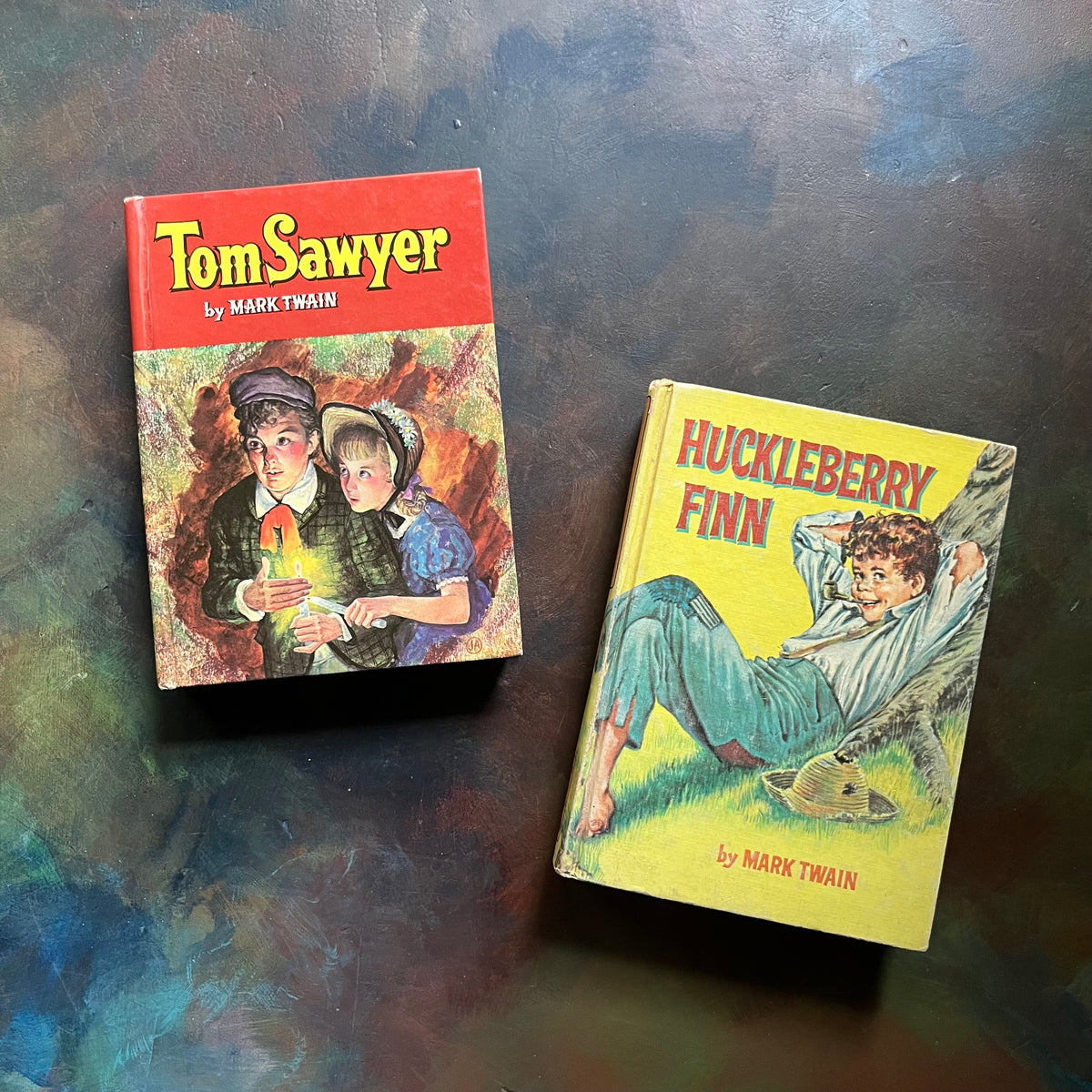 Whitman Classics Huckleberry Finn & Tom Sawyer written by Mark Twain with illustrations by Cart & Paul Frame-vintage children's chapter books-banned books-view of the front covers