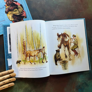 Winnie written by Sally M. Walker with illustrations by Jonahan D. Voss-The True Story of the Bear Who Inspired Winnie-The-Pooh-view of the illustrations showing the bear with horses