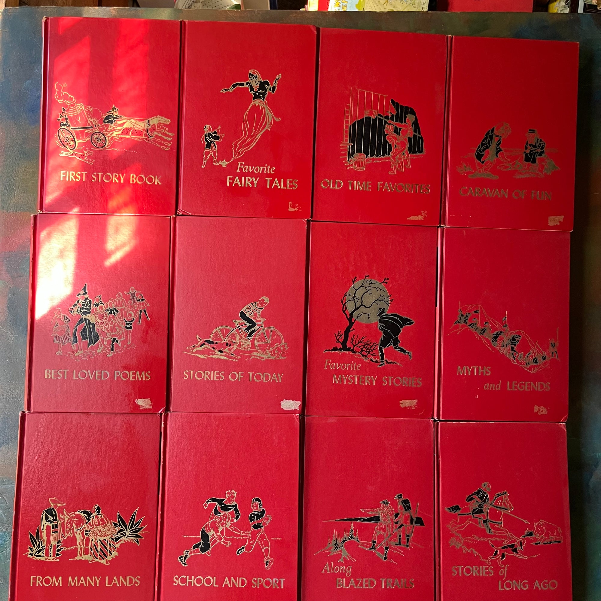 vintage children's storybook set-The Children's Hour Complete 16 Volume Book Set-spines-Sears, Roebuck and Company Exclusive-view of the front covers - note the damage where stickers were removed