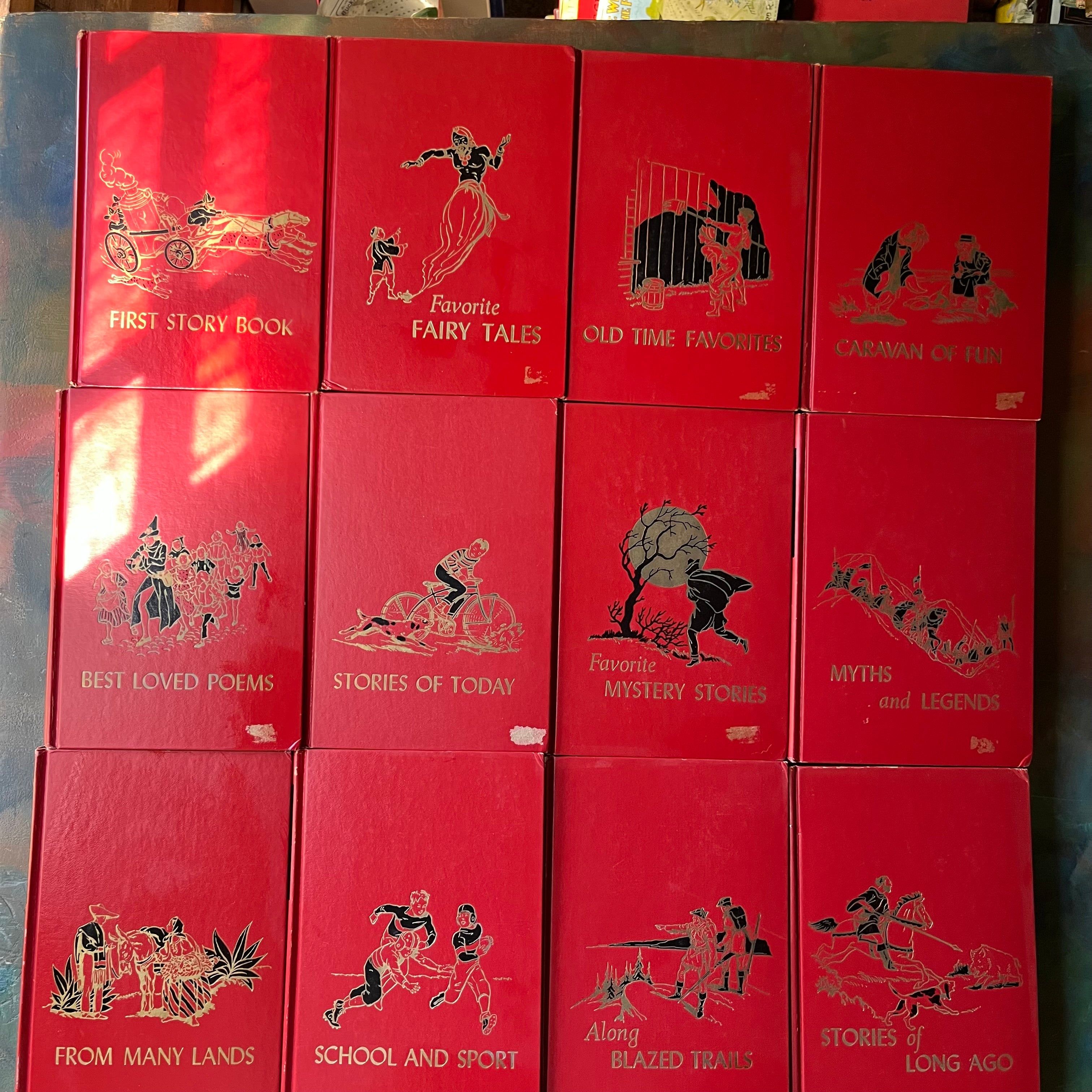 vintage children's storybook set-The Children's Hour Complete 16 Volume Book Set-spines-Sears, Roebuck and Company Exclusive-view of the front covers - note the damage where stickers were removed