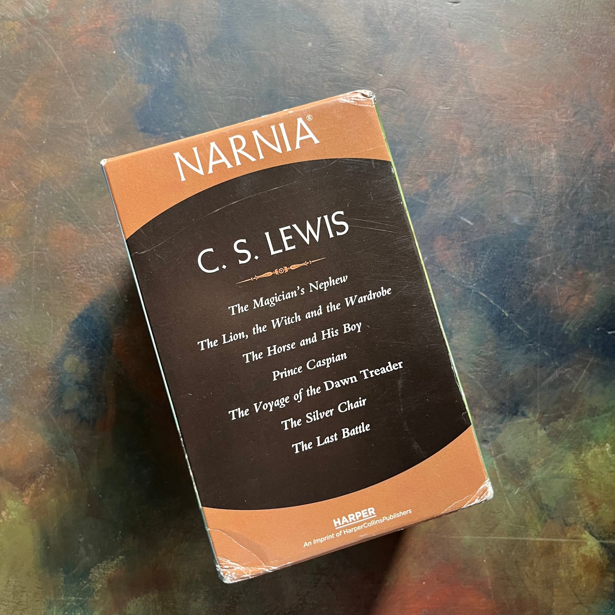 vintage children’s books-box set–The Chronicles of Narnia Complete Box Set written by C. S. Lewis-classic children's books that should be on every child's bookshelf - view of the back of the box listing titles in the set