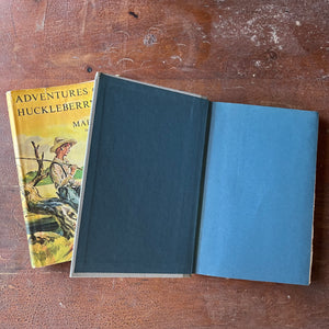 Log Cabin Vintage – vintage children’s book, children’s book, chapter books, Junior Deluxe Editions – Adventures of Huckleberry Finn by Mark Twain with illustrations by Richard M. Powers - view of the inside cover in a beautiful turquoise color
