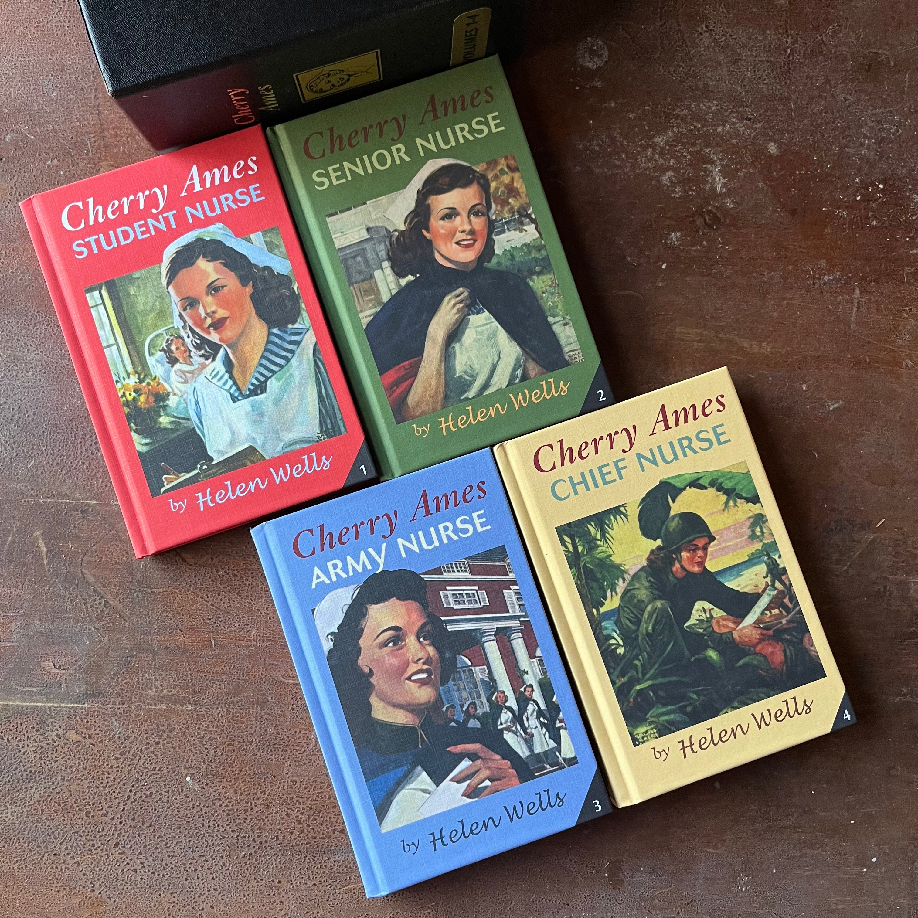 Log Cabin Vintage – vintage children’s book, children’s book, chapter book, Cherry Ames - Cherry Ames Box Set by Helen Wells Volumes 1 - 4 - View of the front covers in red, green, blue and yellow