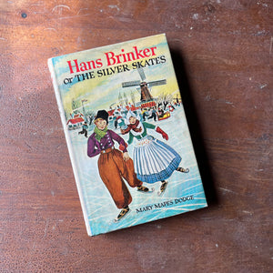 Log Cabin Vintage - vintage children's book, children's chapter book, Junior Deluxe Editions - Hans Brinker or the Silver Skates by Mary Mapes Dodge - view of the dust jacket's front cover