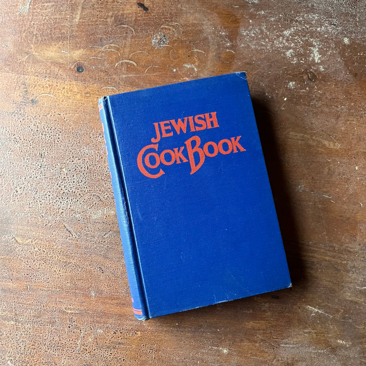 Log Cabin Vintage - vintage non-fiction, vintage cookbook, Jewish History - Jewish Cookbook by Mildred Grosberg Bellin - view of the bright blue front cover with red writing in a wonderful, vintage script