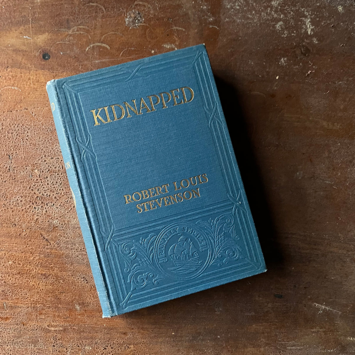 Log Cabin Vintage – vintage children’s book, children’s book, chapter book – Kidnapped by Robert Louis Stevenson with illustrations by Milo Winter - a 1916 Edition - view of the embossed front cover