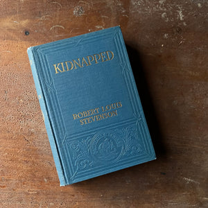 Log Cabin Vintage – vintage children’s book, children’s book, chapter book – Kidnapped by Robert Louis Stevenson with illustrations by Milo Winter - a 1916 Edition - view of the embossed front cover