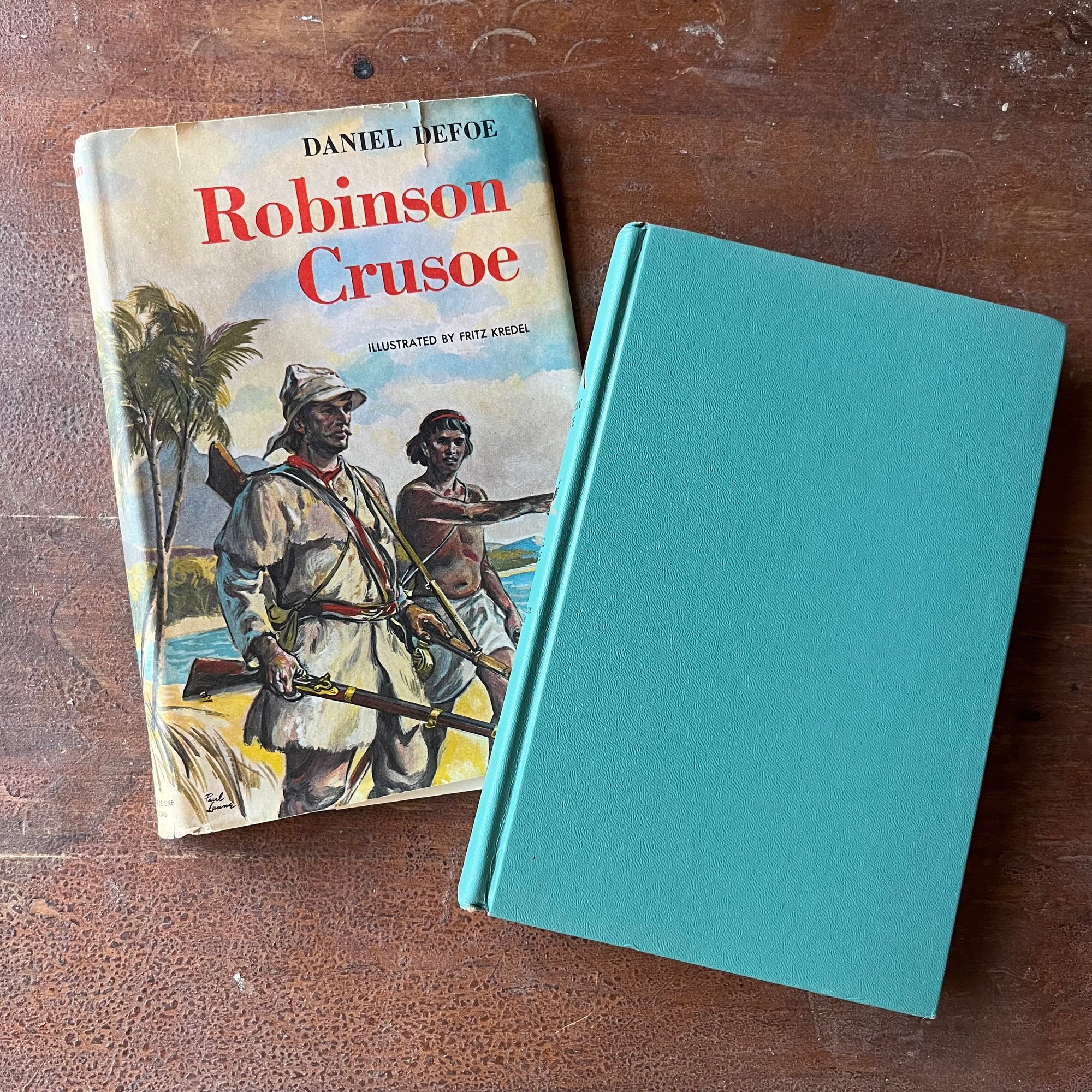 Log Cabin Vintage – vintage children’s book, children’s book, chapter books, Junior Deluxe Editions – Robinson Crusoe by Daniel DeFoe with illustrations by Fritz Kredel - view of the turquoise blue front cover