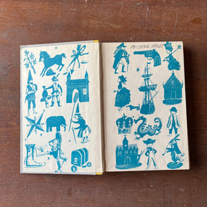 Log Cabin Vintage - vintage children's book, children's book, chapter book, Junior Deluxe Editions Book - Toby Tyler by James Otis with illustrations by Leonard Weisgard - 1958 Edition - view of the book open to the inside cover sitting on a wood table
